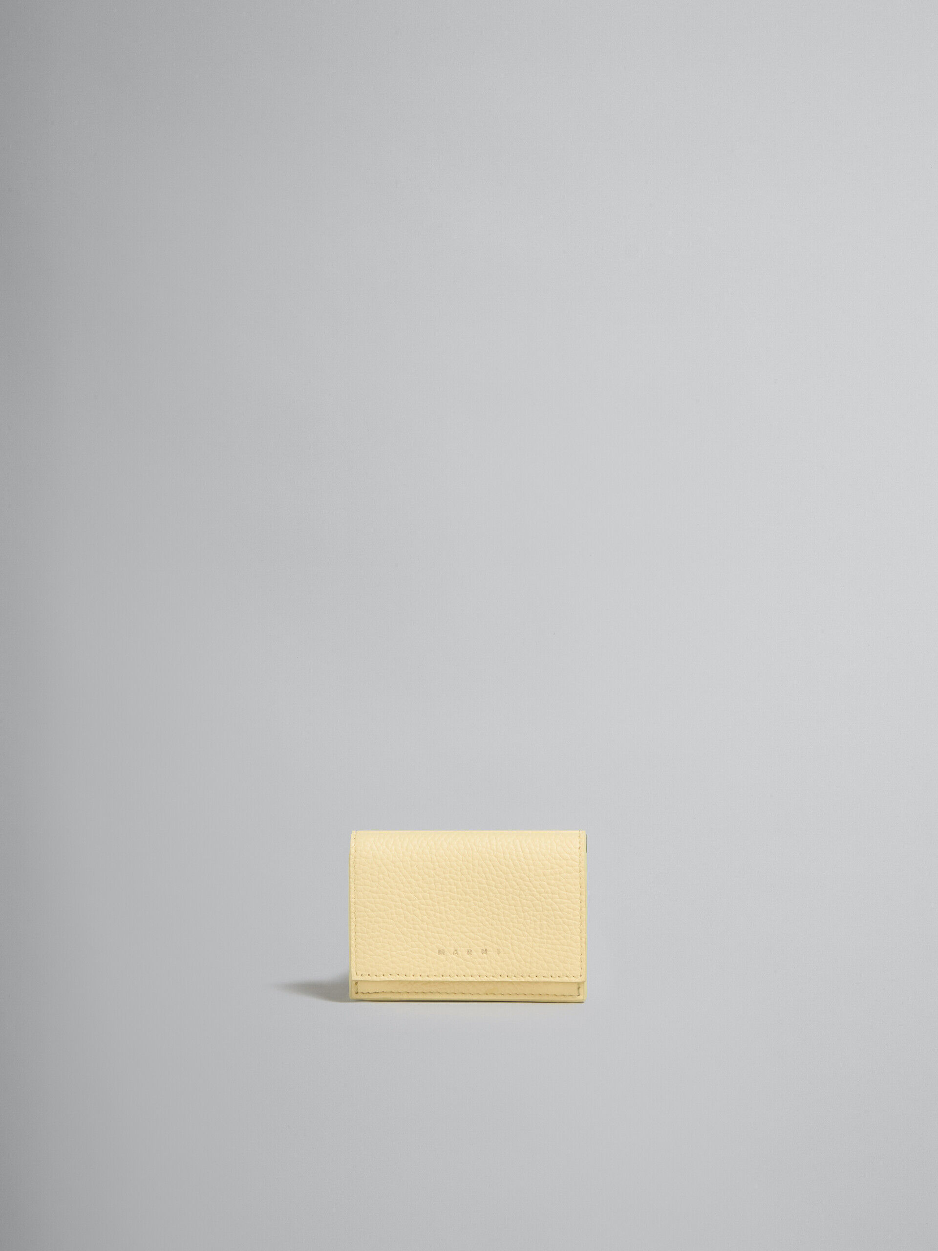 Light yellow leather trifold Venice wallet with marbled interior