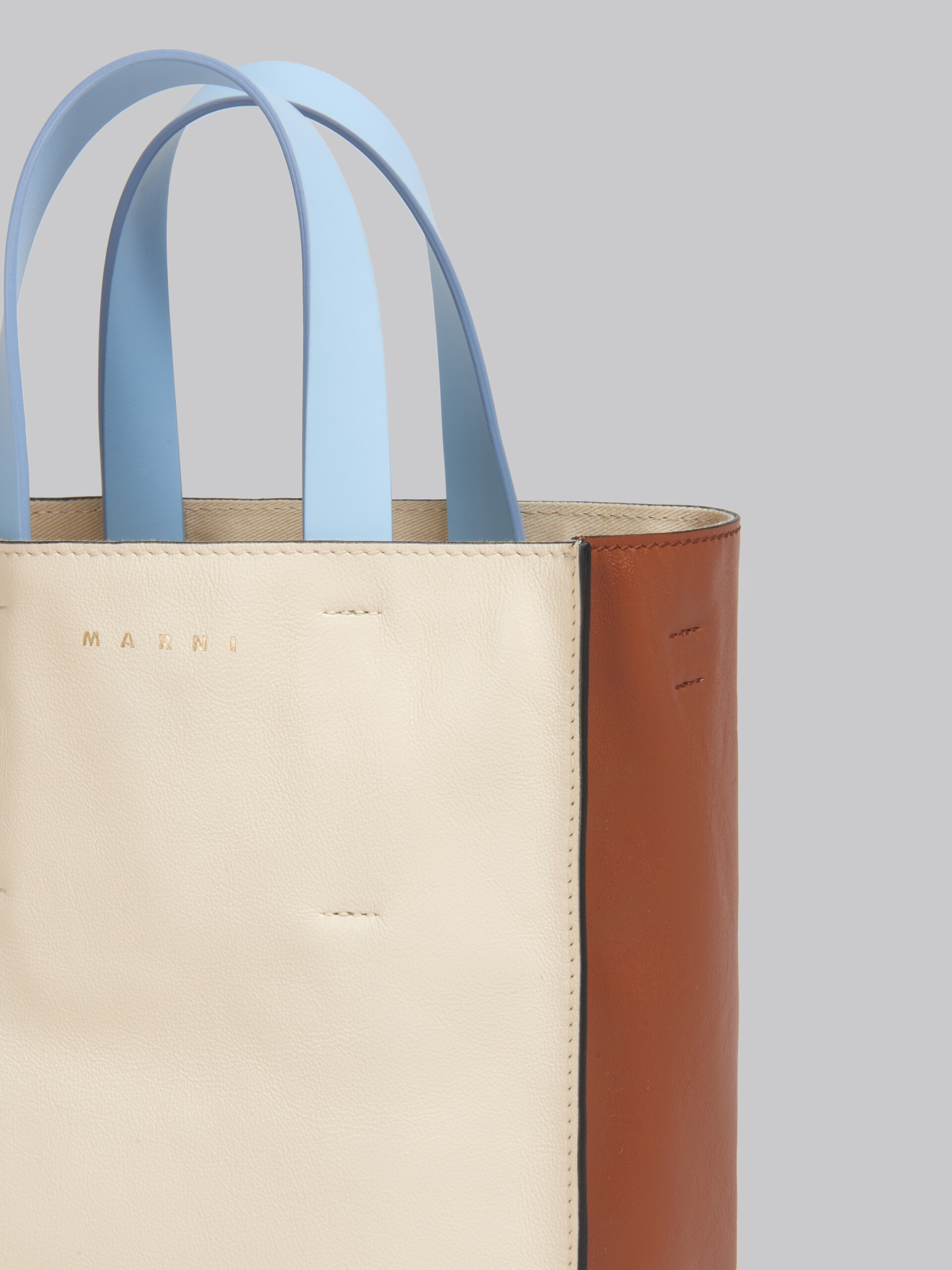 Museo Soft Nano Bag in light blue and white leather
