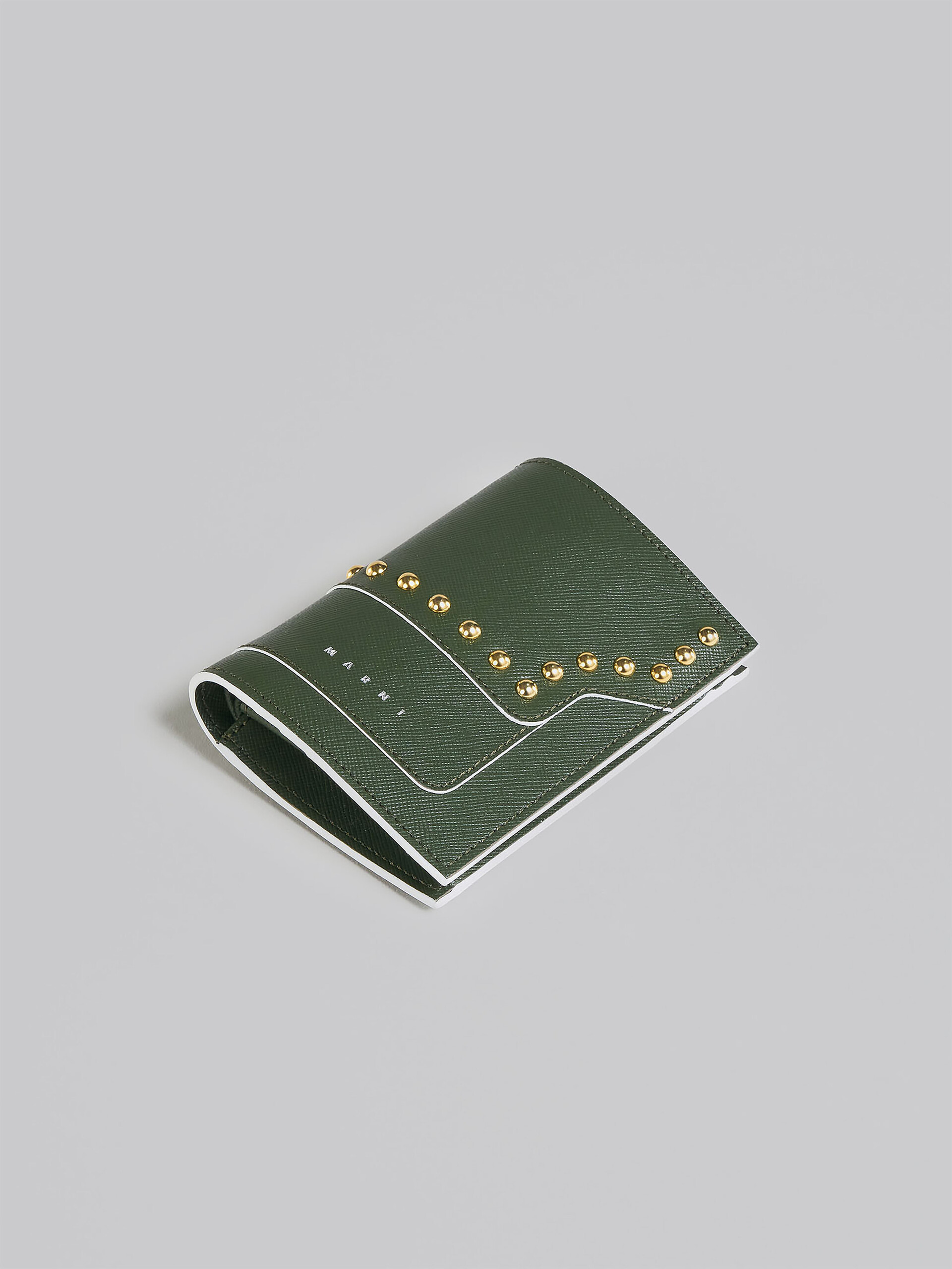 Green saffiano leather bi-fold wallet with studs