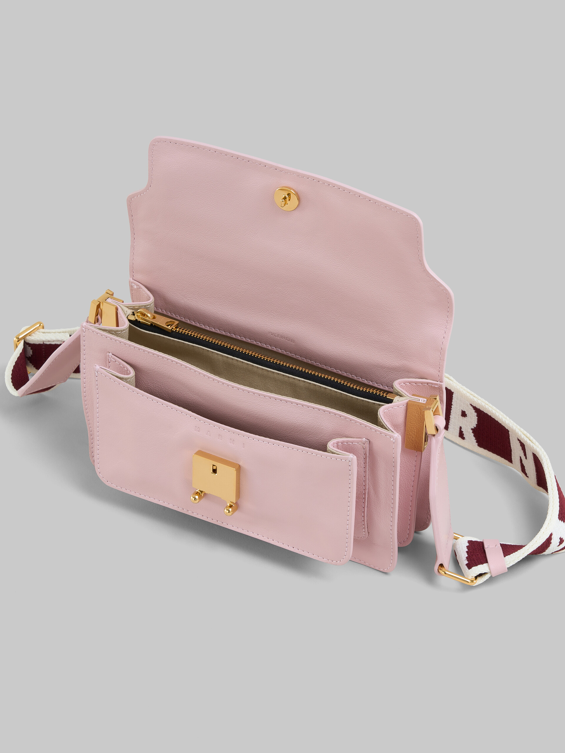 Shop MARNI Pink leather E/W Soft Trunk Bag with logo strap  (SBMP0124Q6P264400C09) by -TAO