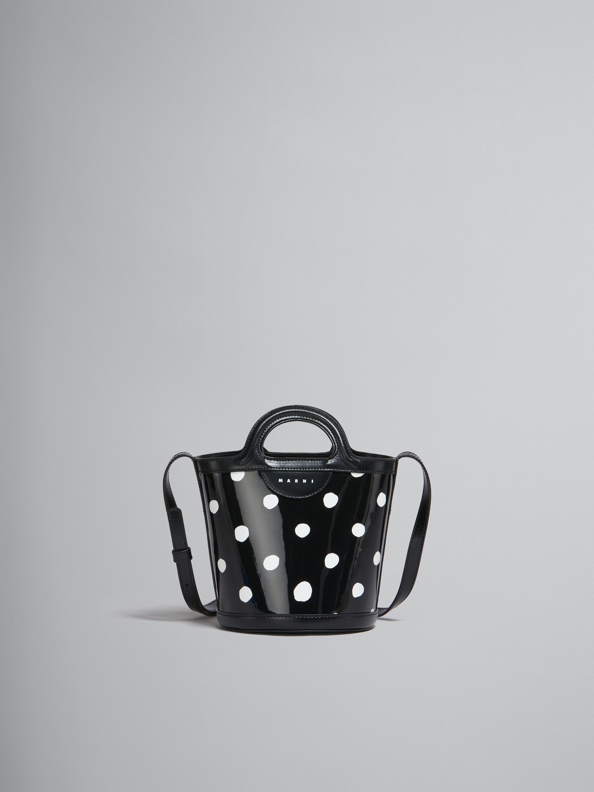Black and white polka-dot patent leather Tropicalia mini bucket bag