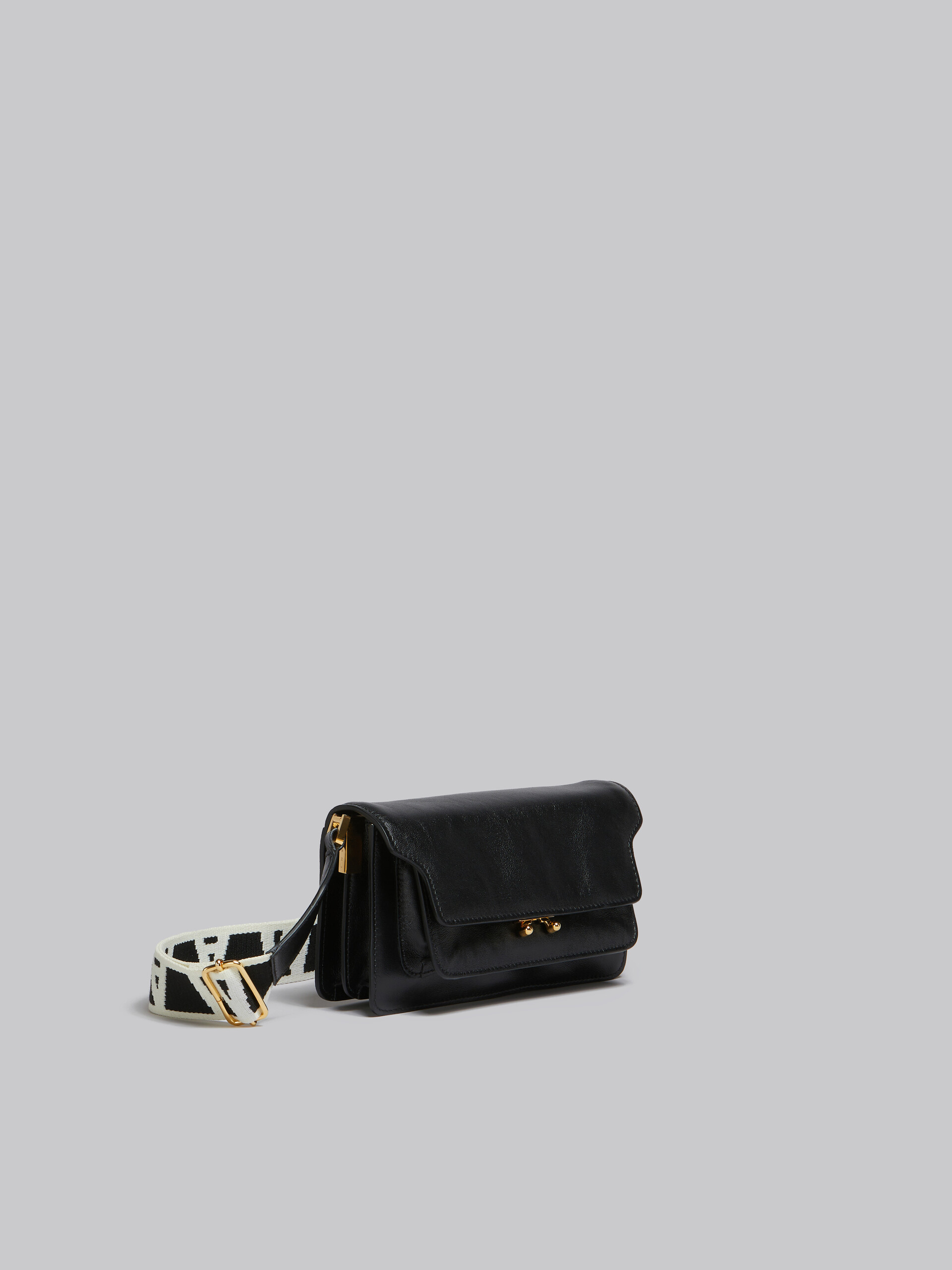 Black leather E/W Soft Trunk Bag with logo strap