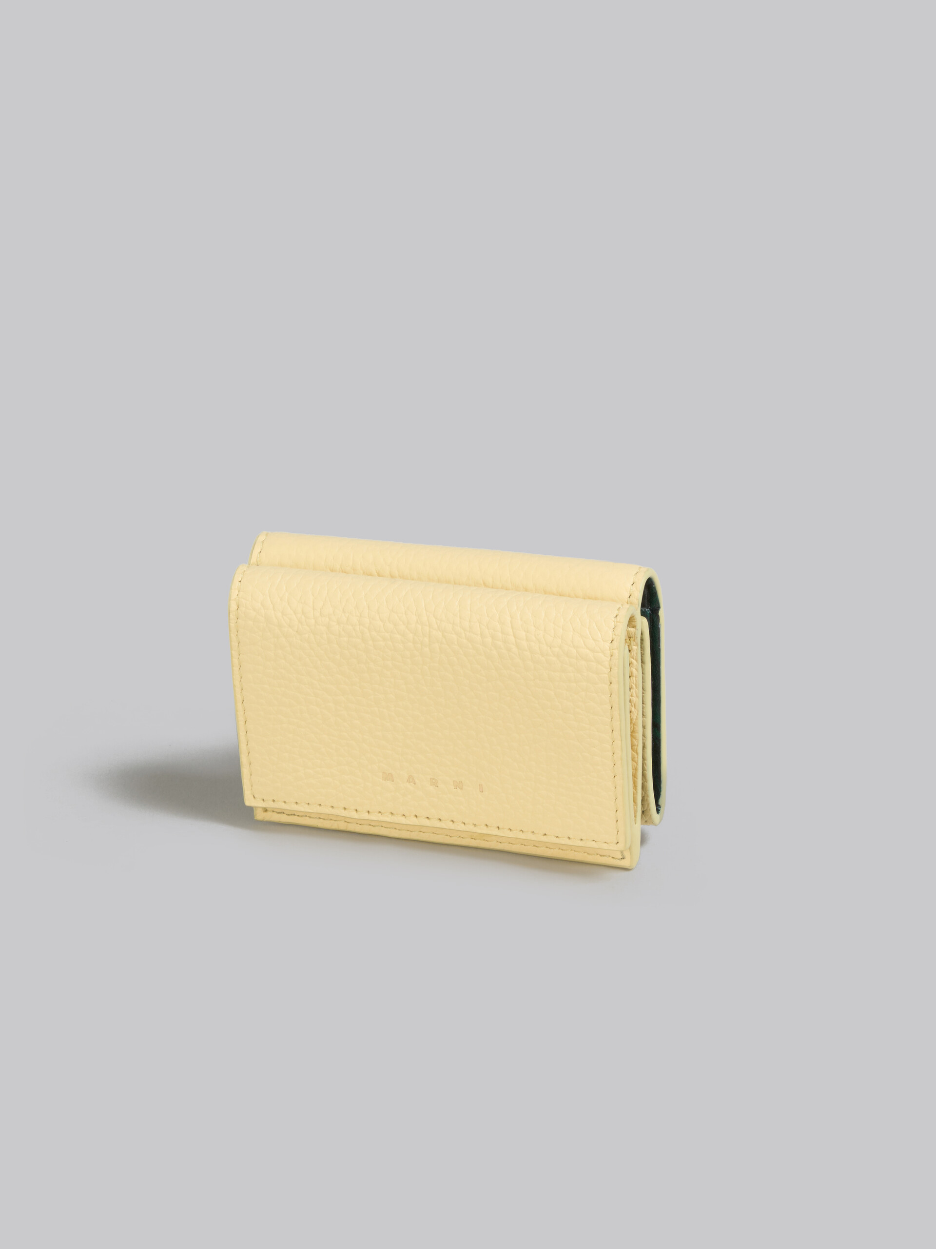 Light yellow leather trifold Venice wallet with marbled interior