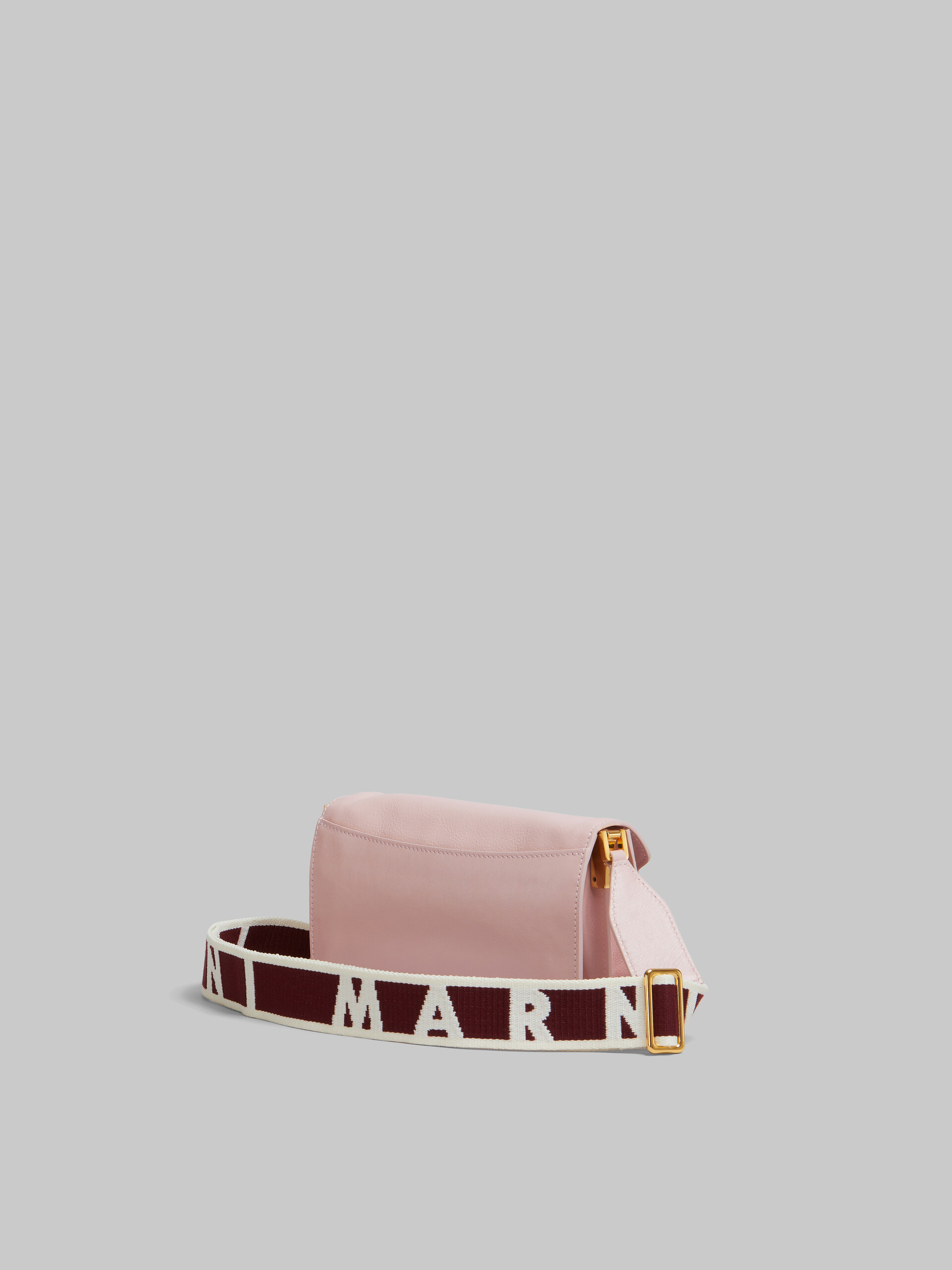 Shop MARNI Pink leather E/W Soft Trunk Bag with logo strap  (SBMP0124Q6P264400C09) by -TAO