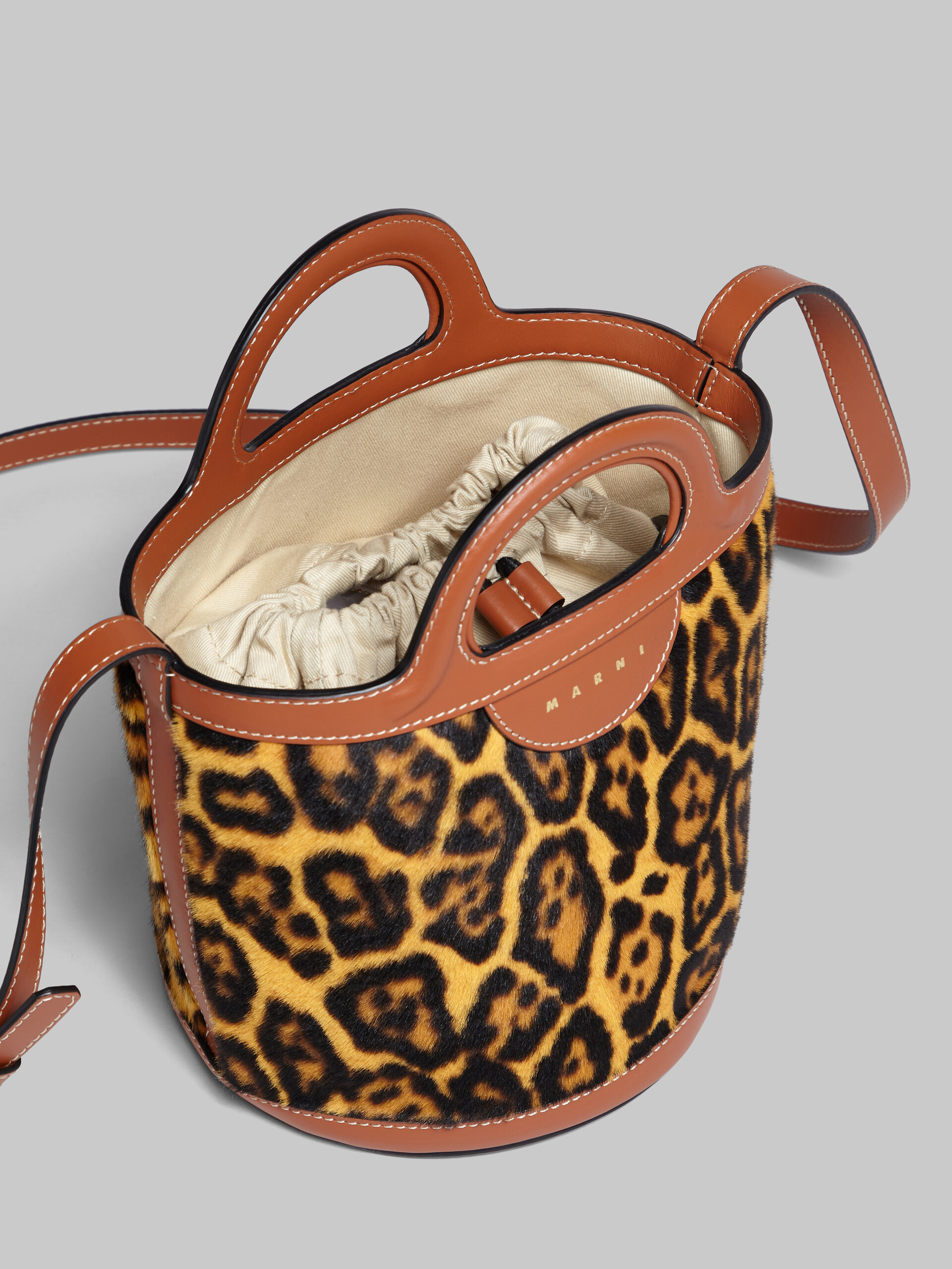 Tropicalia mini bucket bag in leopard-print short-hair shearling